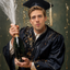 The Celebratory Scholar man graduation portrait