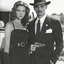 The Roaring Twenties Gangster & Glamorous Gun - Toting Dame Couple Portrait